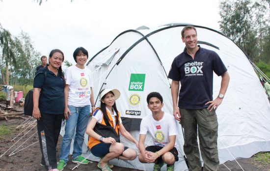 ShelterBox response volunteers with disaster relief tent in Philippines