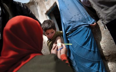 A child is examined by a UNICEF health worker to assess for malnutrition