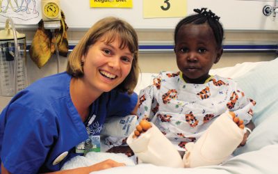 Nurse provides medical to child support on Mercy Ship