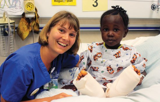 Nurse provides medical to child support on Mercy Ship