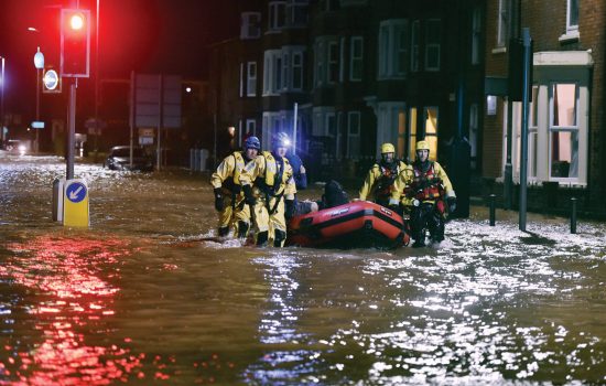 rescue team looking for people stranded by the floods