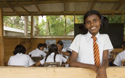 Girl in school in India receiving education and literacy