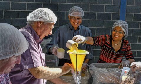 Rotary volunteers pack meals for Africa for Rise Against Hunger