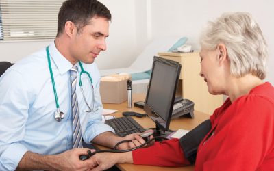 doctor checks blood pressure for stroke symptoms