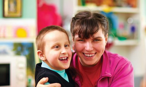 teacher with blind child in school for the blind