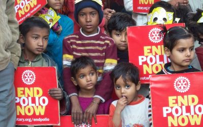 children holding a rotary end polio now sign