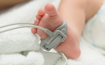 baby foot measurement on soft blanket