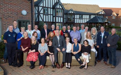 rotary members smiling fast charter