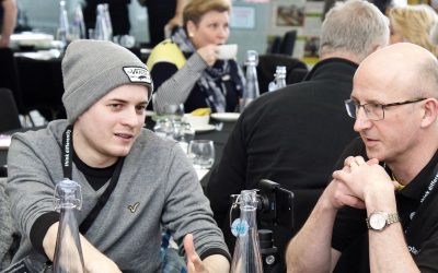 volunteers talking at a seminar for think differently