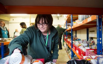 woman sorting food at the foodbank