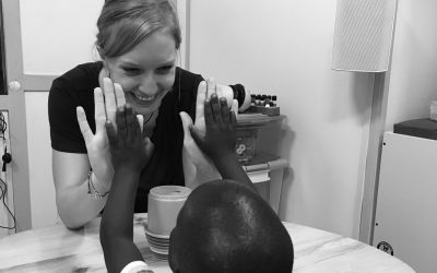 child volunteer high five hearing test