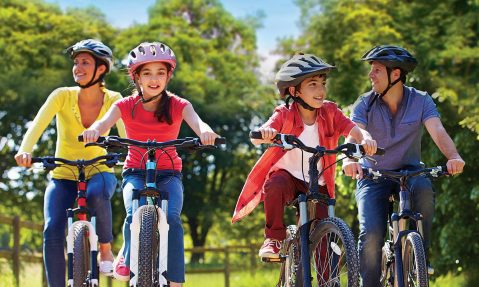 family bike ride summer smiling fun fundraiser