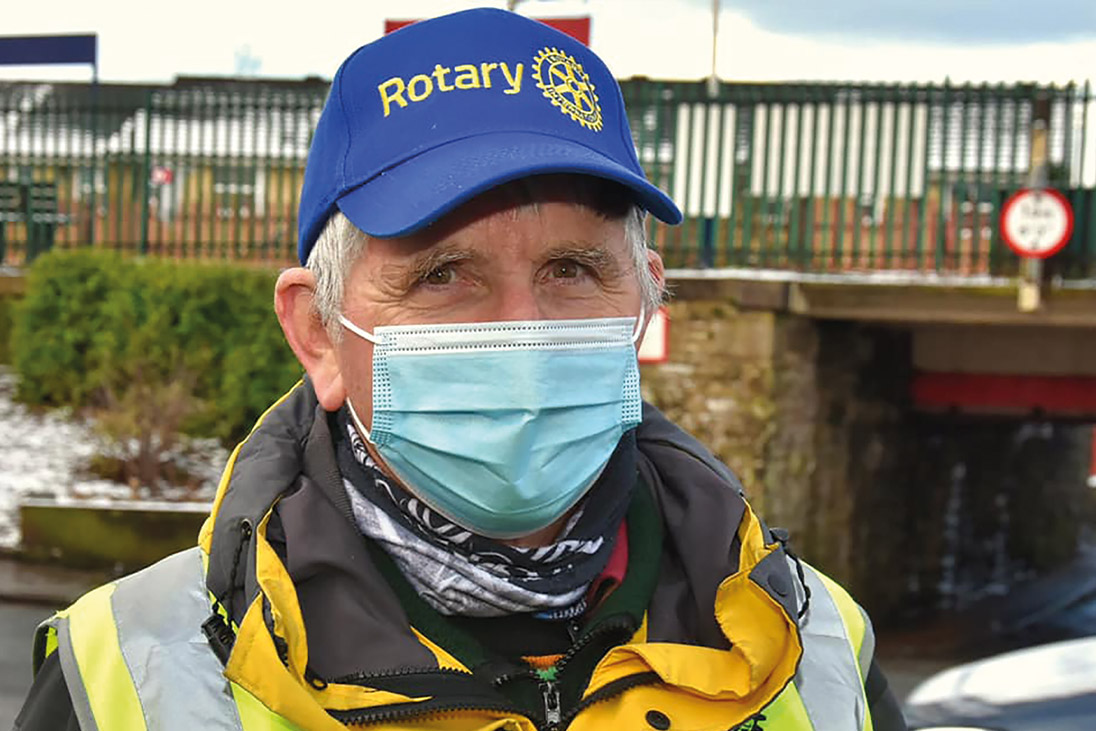 rotary volunteer wearing mask